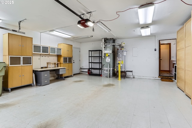 garage with water heater and a garage door opener