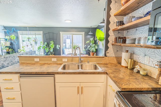9511 NE 73rd St, Vancouver, WA 98662 - kitchen with white dishwasher, a textured ceiling, a peninsula, open shelves, and white cabinetry