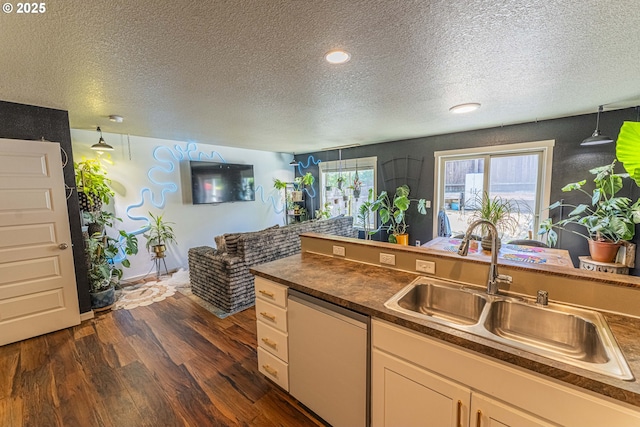 9511 NE 73rd St, Vancouver, WA 98662 - kitchen with white dishwasher, a textured ceiling, dark countertops, dark wood-style flooring, and recessed lighting