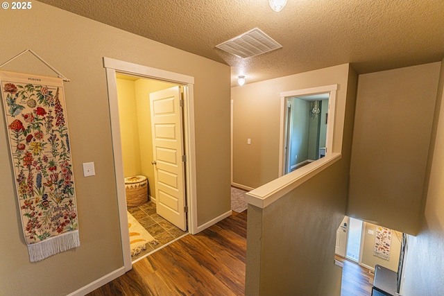 9511 NE 73rd St, Vancouver, WA 98662 - hallway with dark wood finished floors, an upstairs landing, and a textured ceiling