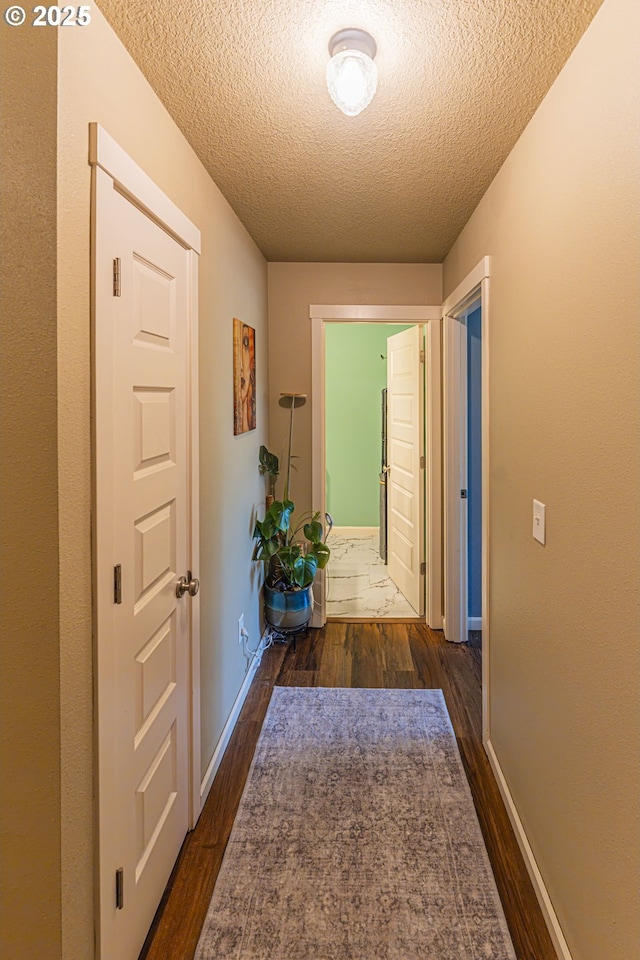 9511 NE 73rd St, Vancouver, WA 98662 - corridor with a textured ceiling and dark wood finished floors