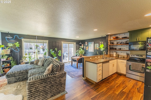 9511 NE 73rd St, Vancouver, WA 98662 - kitchen featuring stainless steel appliances, dark wood-type flooring, a textured ceiling, open shelves, and recessed lighting