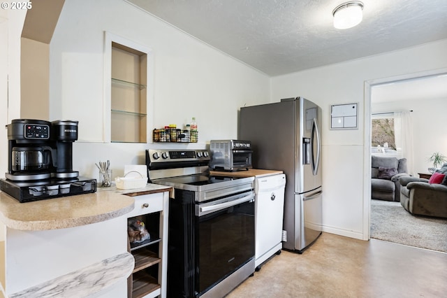 kitchen with appliances with stainless steel finishes and a textured ceiling