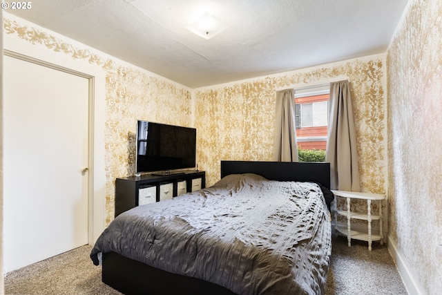 carpeted bedroom with a textured ceiling