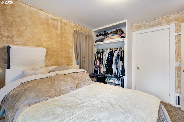 bedroom with a closet and carpet flooring