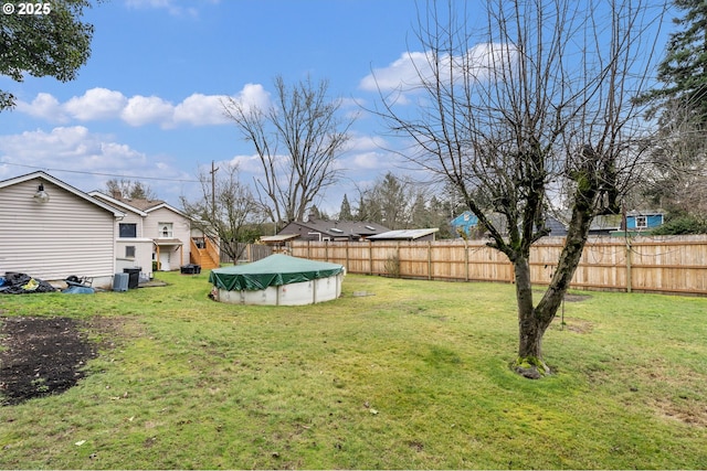 view of yard featuring a covered pool