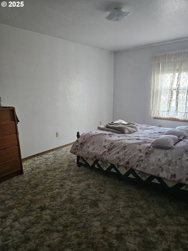 unfurnished bedroom featuring carpet flooring and a textured ceiling