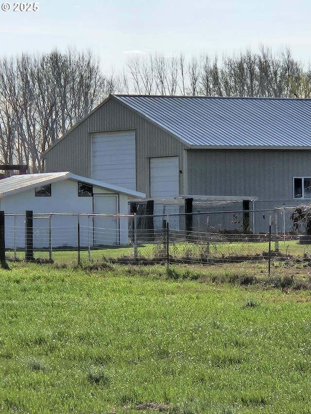 garage featuring a lawn