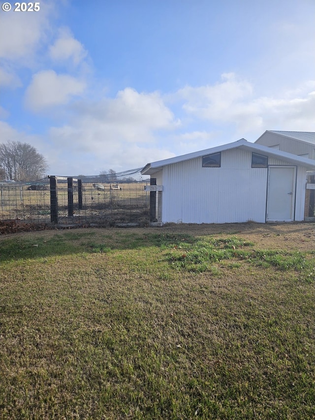 view of yard with a rural view