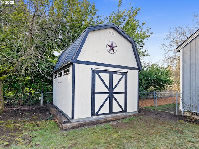 view of outdoor structure featuring a lawn