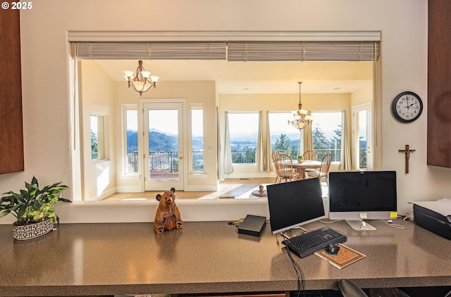 home office featuring an inviting chandelier