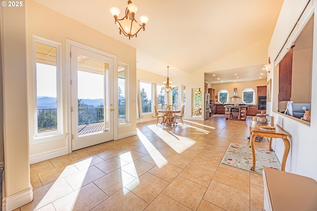 interior space with a mountain view, vaulted ceiling, and a chandelier