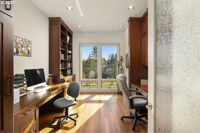 home office with hardwood / wood-style flooring