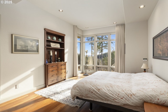 bedroom with light hardwood / wood-style flooring