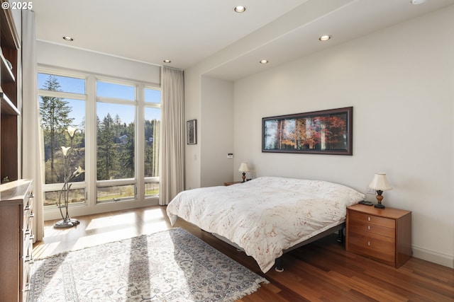 bedroom with hardwood / wood-style flooring