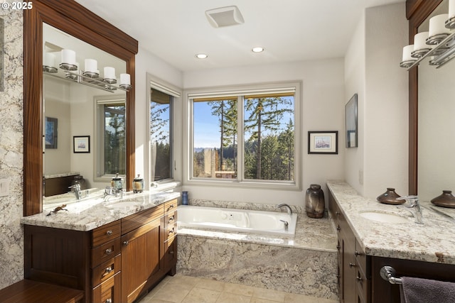 bathroom with vanity, tile patterned flooring, and a relaxing tiled tub