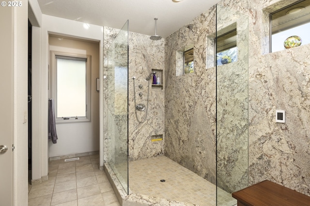 bathroom with tiled shower