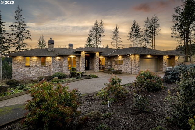 prairie-style house featuring a garage