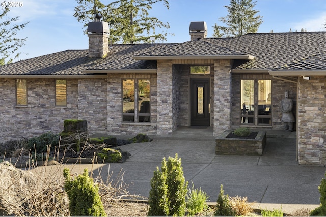 entrance to property featuring a patio area