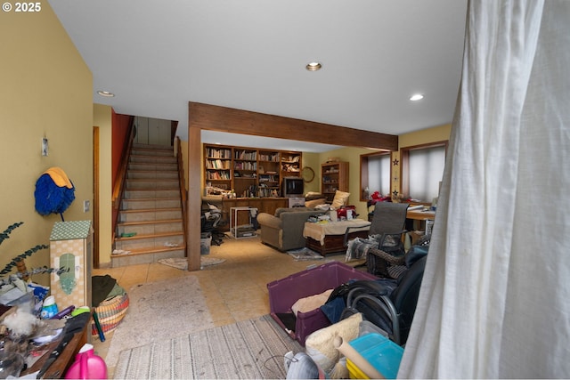 tiled living area with recessed lighting and stairway