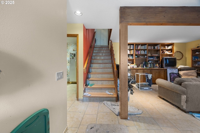 staircase featuring tile patterned flooring