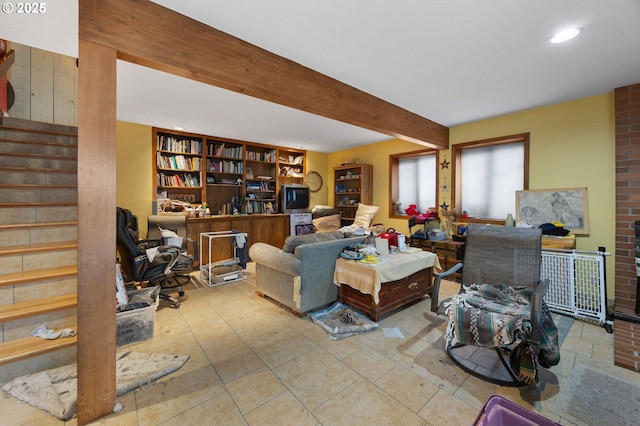 living area featuring recessed lighting, stairway, and beam ceiling