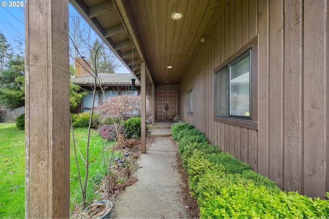 view of exterior entry with board and batten siding