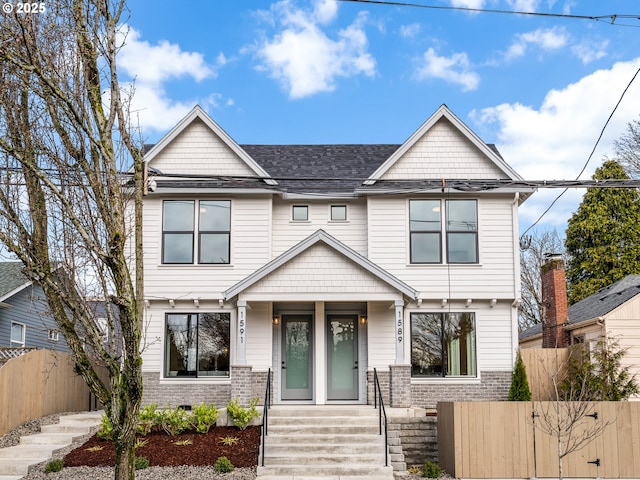 view of front of home featuring fence private yard and a shingled roof