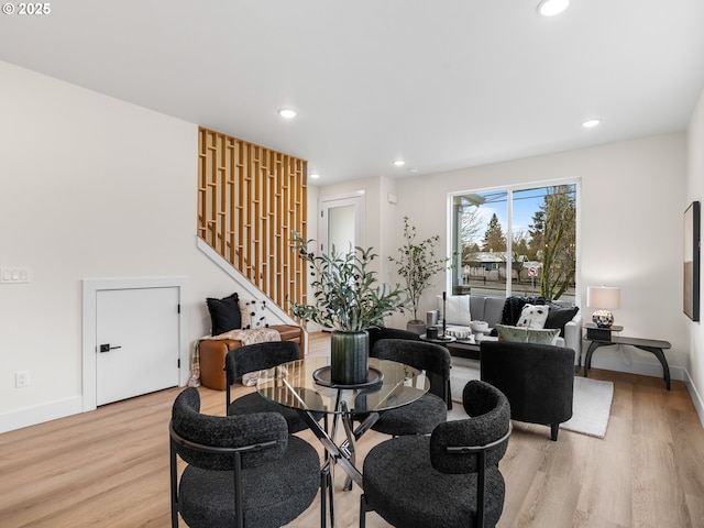 living room featuring light wood finished floors, stairway, recessed lighting, and baseboards