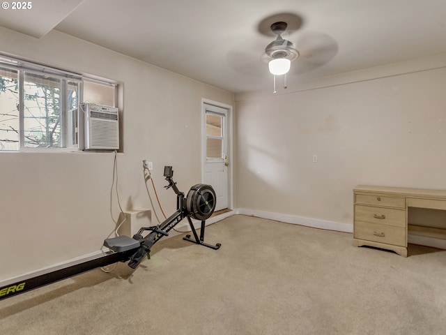 exercise room featuring ceiling fan and light colored carpet