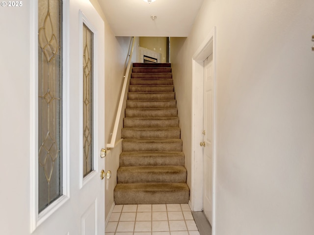 staircase with tile patterned flooring