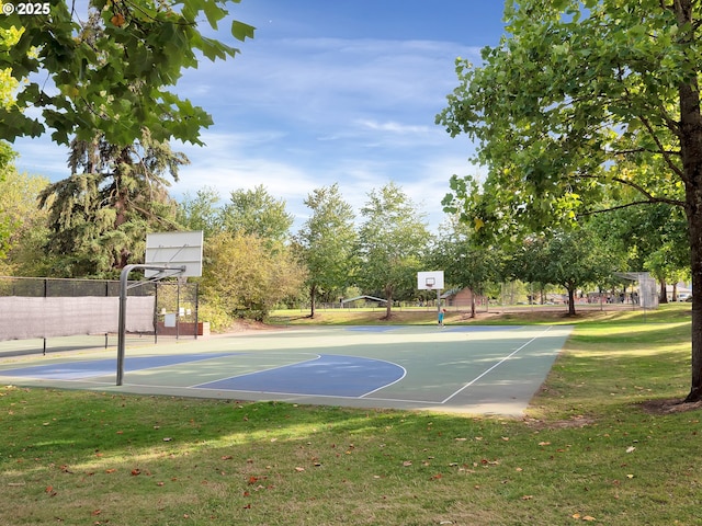 view of basketball court featuring a lawn