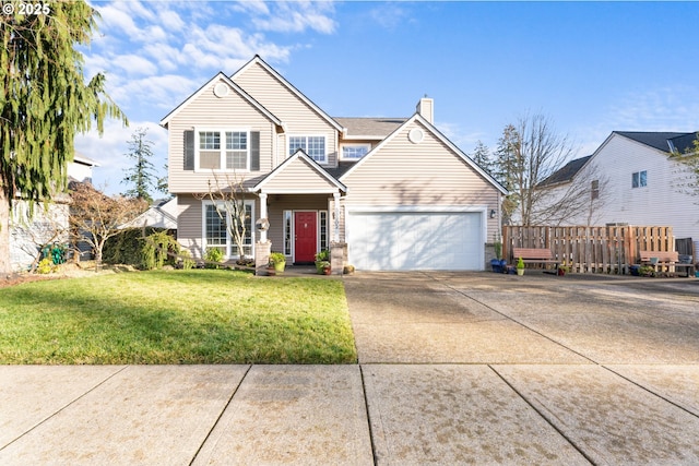 view of front of property featuring a front lawn and a garage