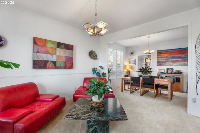 carpeted living room with a chandelier