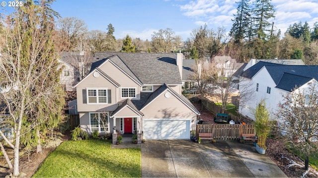 view of front of house featuring a garage and a front yard