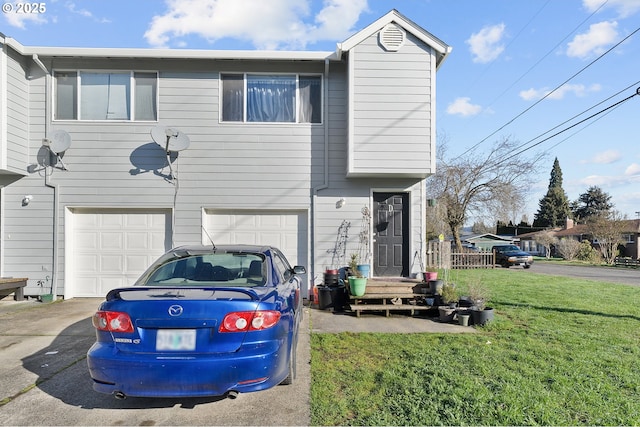 view of front facade with an attached garage, driveway, and a front yard