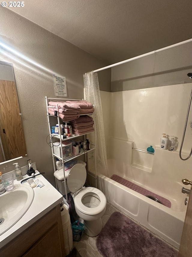 bathroom with shower / tub combo with curtain, a textured wall, toilet, vanity, and a textured ceiling