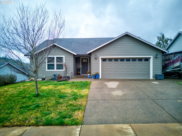 view of front of property featuring a front lawn and a garage