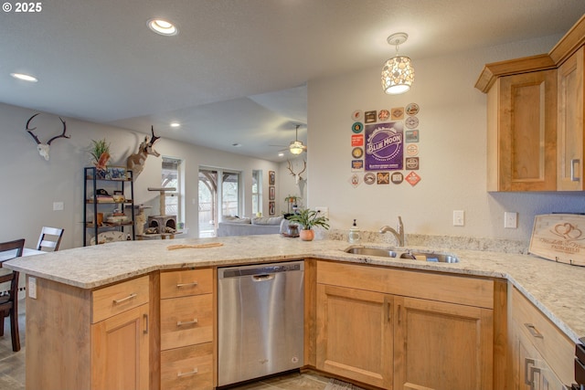 kitchen featuring kitchen peninsula, decorative light fixtures, sink, stainless steel dishwasher, and ceiling fan