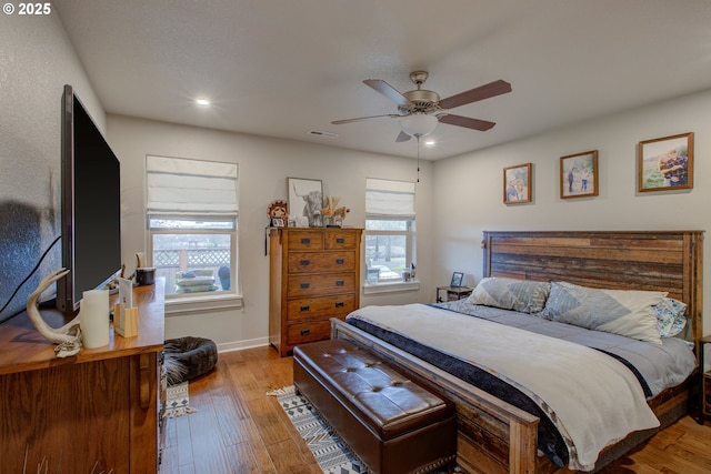 bedroom featuring light hardwood / wood-style floors and ceiling fan