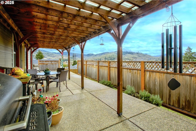 view of patio featuring a mountain view and a pergola