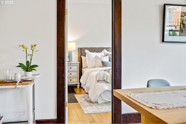 bedroom featuring wood finished floors