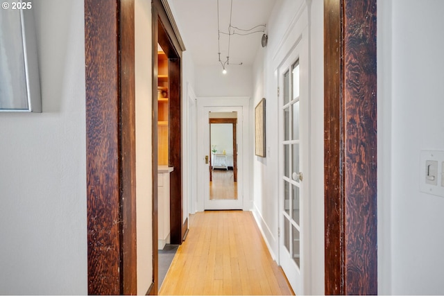hall with light wood-type flooring