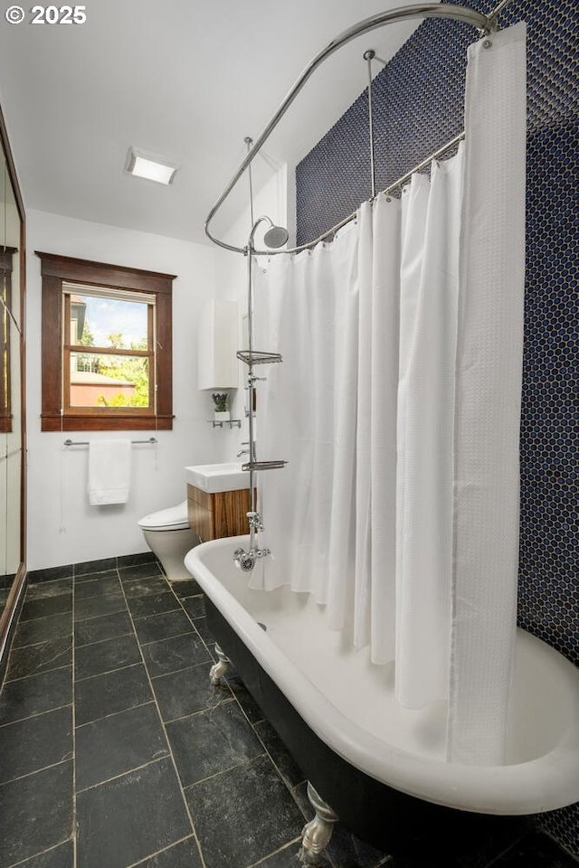 full bathroom with toilet and shower / bath combo