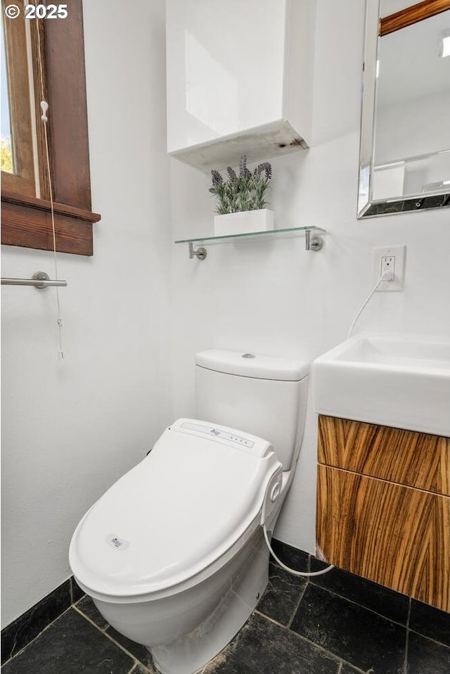 half bath with vanity and toilet