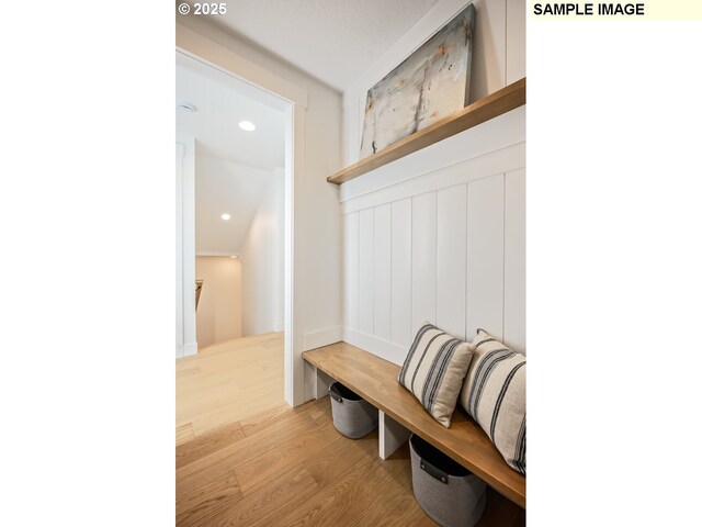 mudroom with recessed lighting and wood finished floors