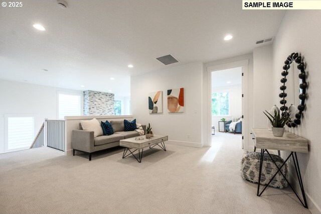 living area with visible vents, recessed lighting, baseboards, and carpet floors