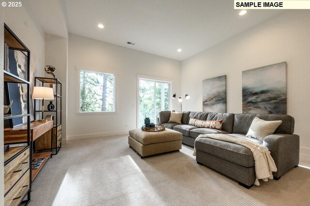 carpeted living room featuring recessed lighting, baseboards, and visible vents