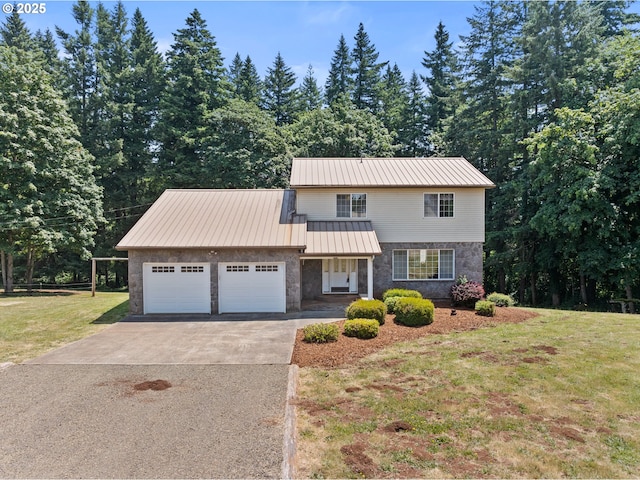 28410 S Beavercreek Rd, Mulino, OR 97042 - traditional home featuring a garage, a front yard, asphalt driveway, and stone siding