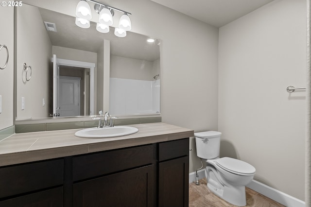 full bathroom featuring visible vents, walk in shower, baseboards, vanity, and toilet